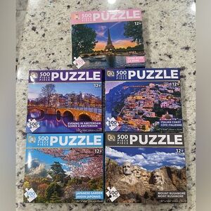 5- 500 Piece Around the World Puzzles. Brand New